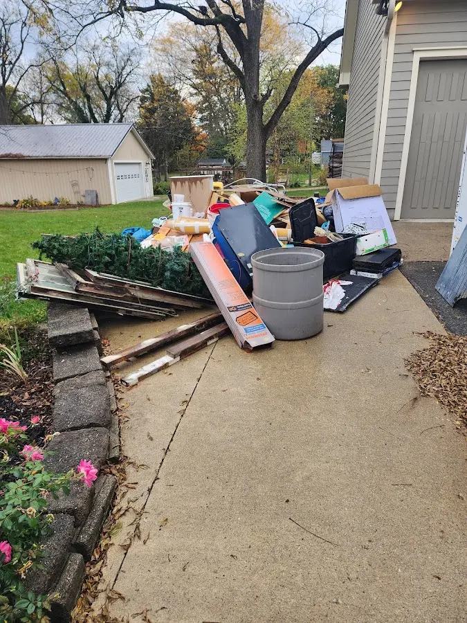 Dumpster being loaded with debris for Residential Dumpster Rental in Commerce